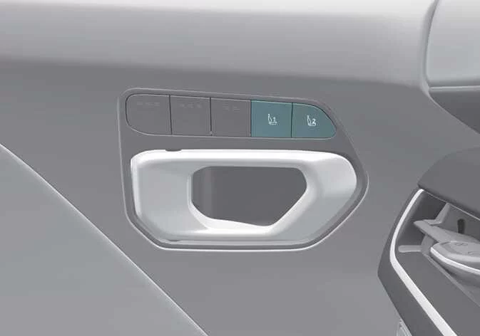 Memory system buttons located on the Kia K4 door panel for seat and mirror adjustment